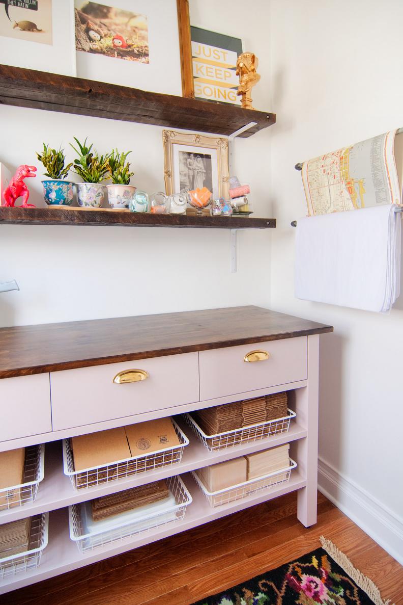 “With little room for more obvious furniture storage in a small area, don’t forget to use the vertical space,” says Kim Vargo of Yellow Brick Home (http://www.yellowbrickhome.com/2014/04/03/the-workroom-ready-to-work/). “Hooks, rods and built-ins can lend so much additional storage while adding a punch of personality.” 

Vargo needed an organized space to store shipping materials for her online shops. Shelving over the worktable and conduit pipes for holding wrapping and packing papers keep everything within reach. Plus, notes Vargo, the “paper pipes” lend a cool industrial vibe to an otherwise feminine spot.