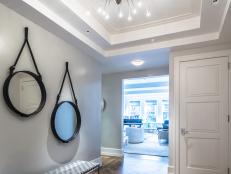Bench and Circular Mirrors in Foyer