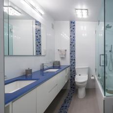 Modern Bathroom With Blue Topped Floating Vanity