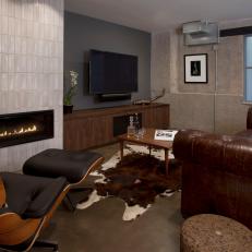 Man Cave With Leather Sofa and Fireplace