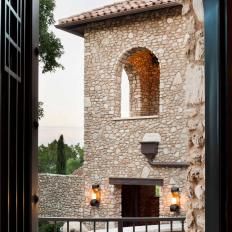 Patio Overlooks Stone Clad Mediterranean Home
