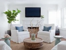 White Contemporary Living Room With White Armchairs & Fireplace