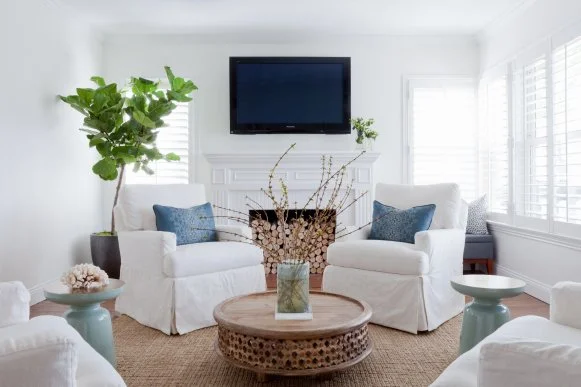 White Contemporary Living Room With White Armchairs & Fireplace