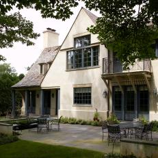 Back of Traditional Home With Shaded Patio