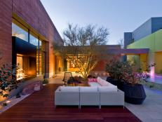 Contemporary Courtyard With Sectional & Infinity Pool at Night
