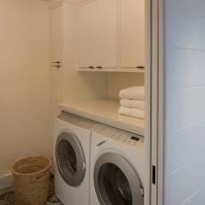 Second Floor Laundry Room With Monochromatic Tile 