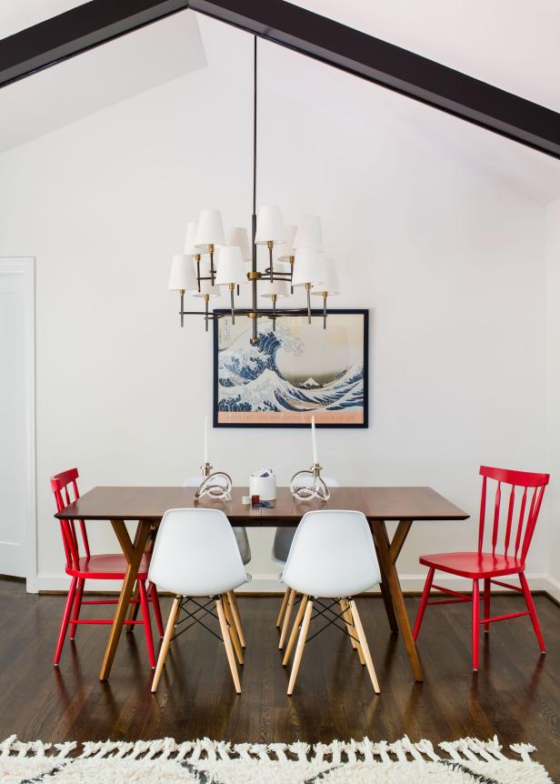Contemporary White Dining Area With Red and White Chairs