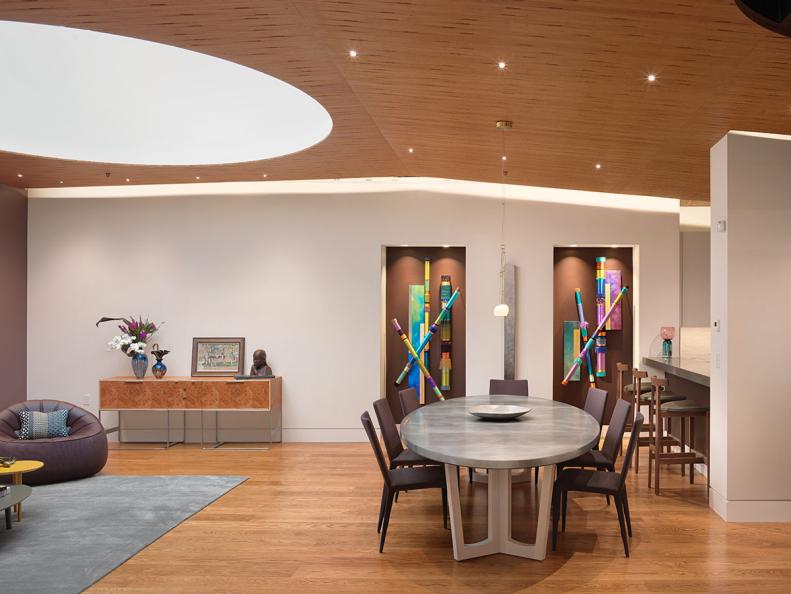 Modern Dining Room With Wood Ceiling & Hardwood Floor