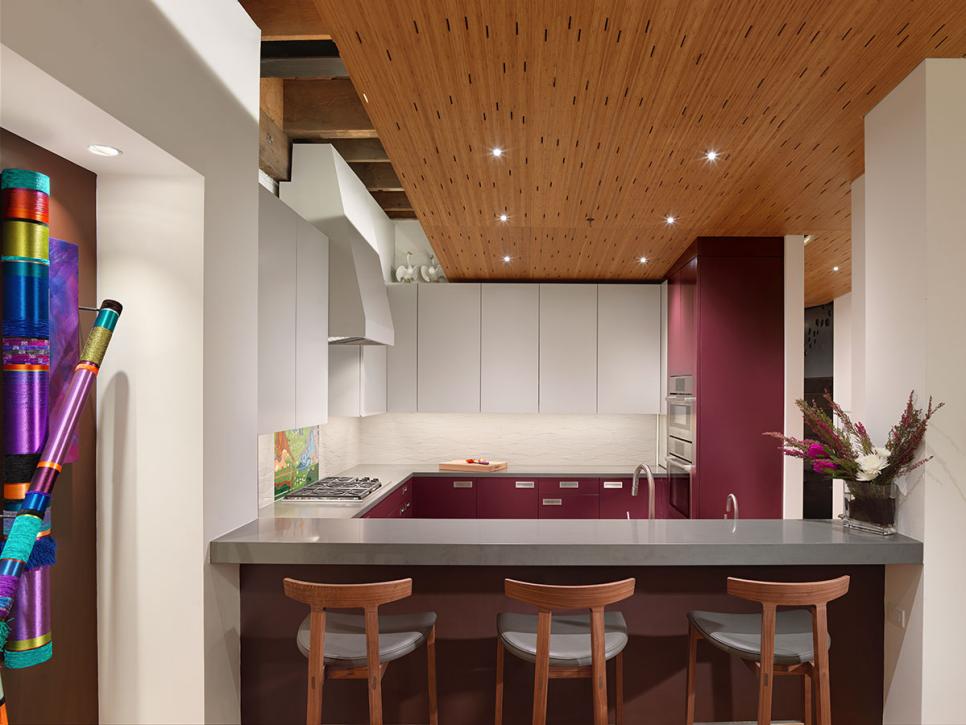 Modern Eat-In Kitchen With Wood Ceiling, Maroon and White Cabinets