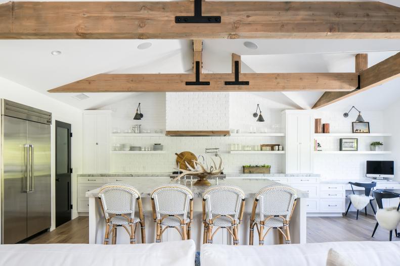 Spacious White Kitchen and Dining Area With Exposed Ceiling Beams ...