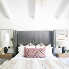 Gray Upholstered Headboard, Black Geometric Table Lamps and Exposed Beams in Contemporary Bedroom 