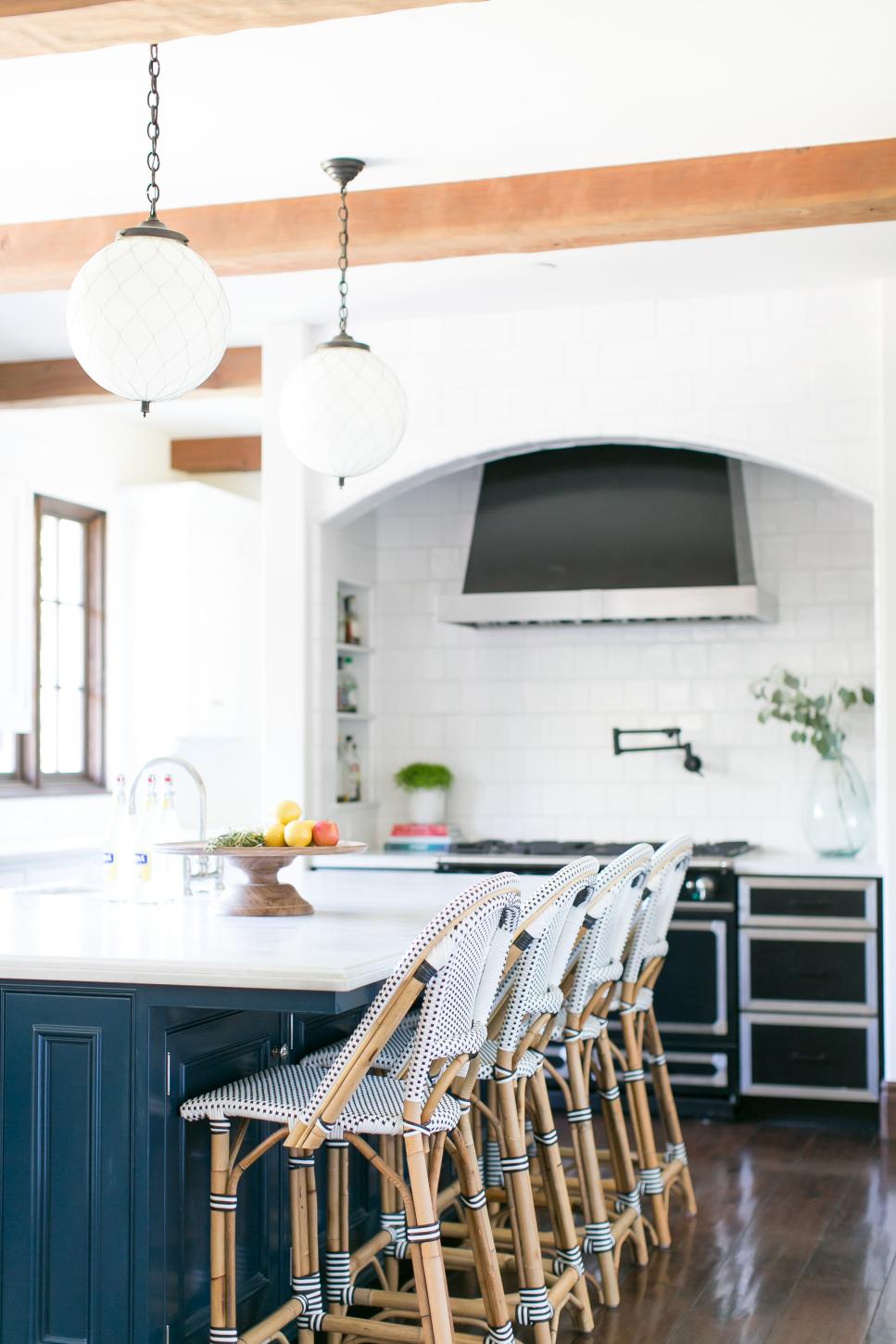 Turquoise Blue Kitchen Island and Wicker Bar Chairs Under Globe Pendant Lights and