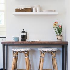 Breakfast Nook With Open Shelves and Barstools