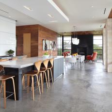 Glass Paneled Walls and Open Floor Plan Make Modern Home Feel Open 