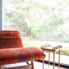 Orange Patterned Chair Adds Unique Seating Options in Midcentury Modern Living Room