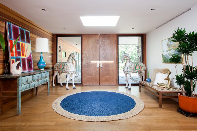 Midcentury Modern Foyer with Vintage Horses and Modern Art
