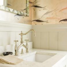 Brass Fixtures in Bathroom Highlight Tones in Fish Wallpaper