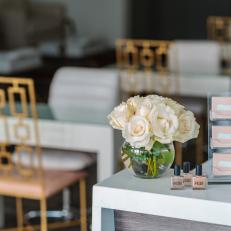 White Roses and Blush Business Cards on Checkout Counter in Paintbar Salon