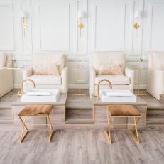 Cream Chairs and Gold and Brown Stools Complement Feminine Design