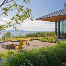 Stone Terrace With Firepit and Lake View