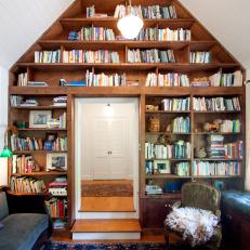 Antique Furniture Meets Boho Accents in Eclectic Library 