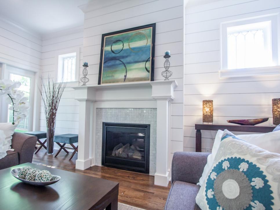 White Living Room with Shiplap Walls and Fireplace | HGTV