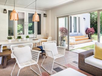 Outdoor Space with White Furniture and Sliding Glass Door