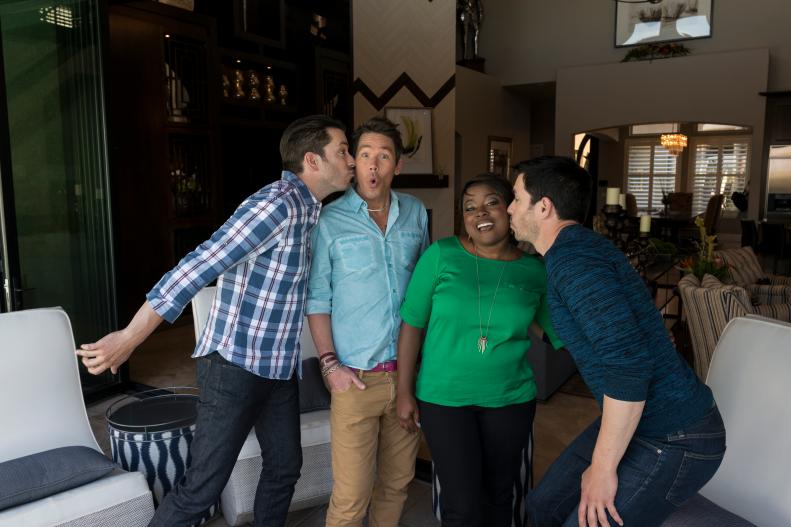 Guest judges Tiffany Brooks and David Bromstad get kisses from Jonathan and Drew Scott inside their home, as seen on Brother vs. Brother. (portrait)