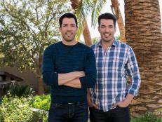 Hosts Drew and Jonathan Scott pose in the back yard of their home , as seen on Brother vs. Brother. (portrait)