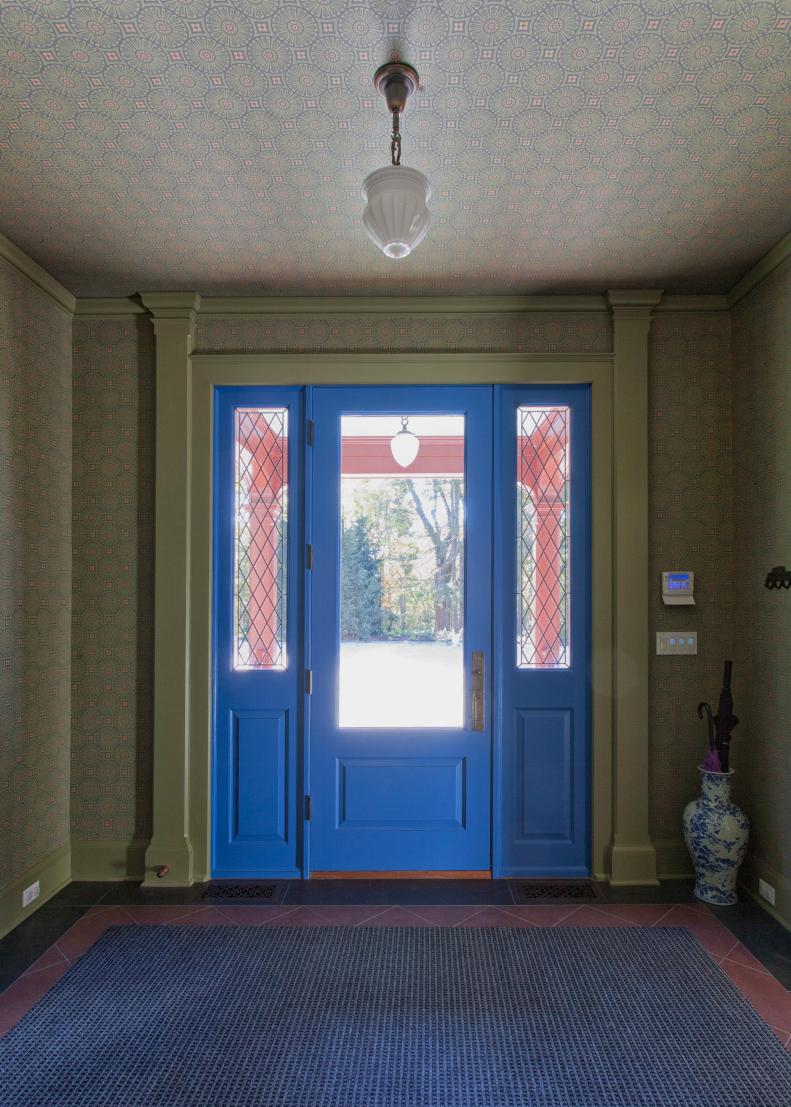 Victorian Foyer With Blue Front Door & Green Pattern Wallpaper