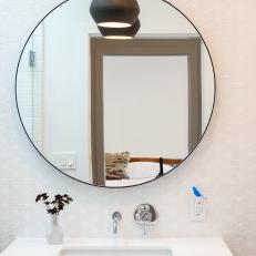 Sleek, Modern Bathroom With Circular Mirror