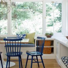 Light and Bright Breakfast Nook With Blue Chairs