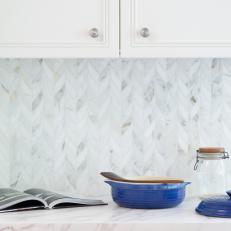 Kitchen With Marble Tile Herringbone Backsplash