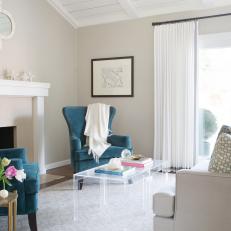 Transitional Living Room With Teal Wingback Chairs