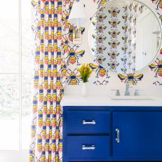 Bee Patterned Bathroom with Bold Colors and Penny-Round Tile Floor