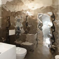 Modern Powder Room With Warped Metallic Tile Wall 