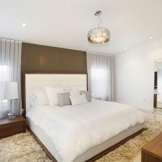 Modern Master Bedroom With a White Leather Platform Bed