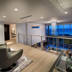 Contemporary Sitting Room With Metal Railing Overlook 