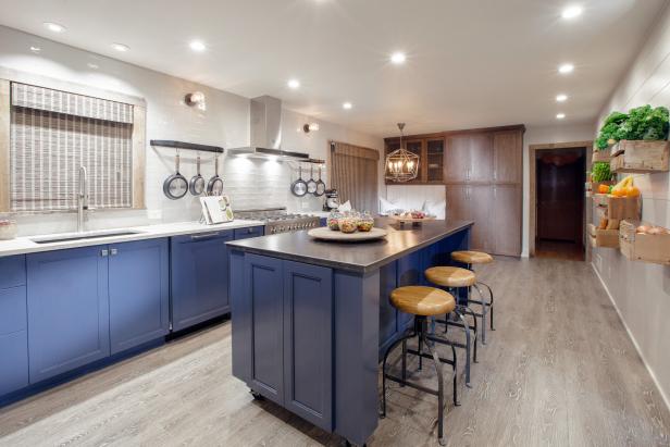Kitchen With Blue Cabinets, White Tile Backsplash and Hardwood Floors