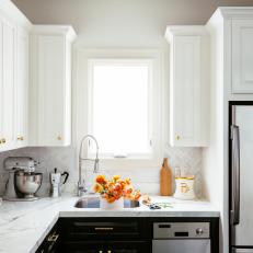 White Herringbone Backsplash and White Marble Countertops in Bright Transitional Kitchen 
