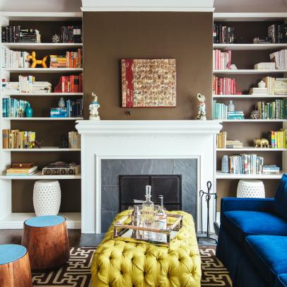 Royal Blue Sofa and Yellow Tufted Coffee Table Under Gold Spiked Light Fixture in Contemporary Living Room 