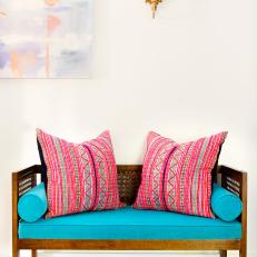 Colorful, Cushioned Settee in Master Bedroom