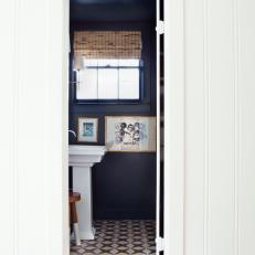 Navy Blue Powder Room With Graphic Tile Floor