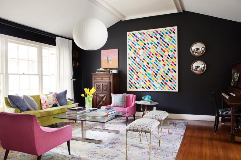 Black Eclectic Living Room With Multicolor Artwork and Furniture