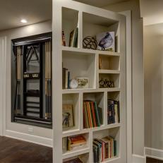 Built-In Shelving Opens to Reveal Extra Storage