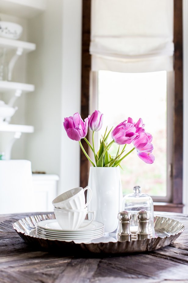 White Dishes on a Silver Tray with a White Vase of Tulips