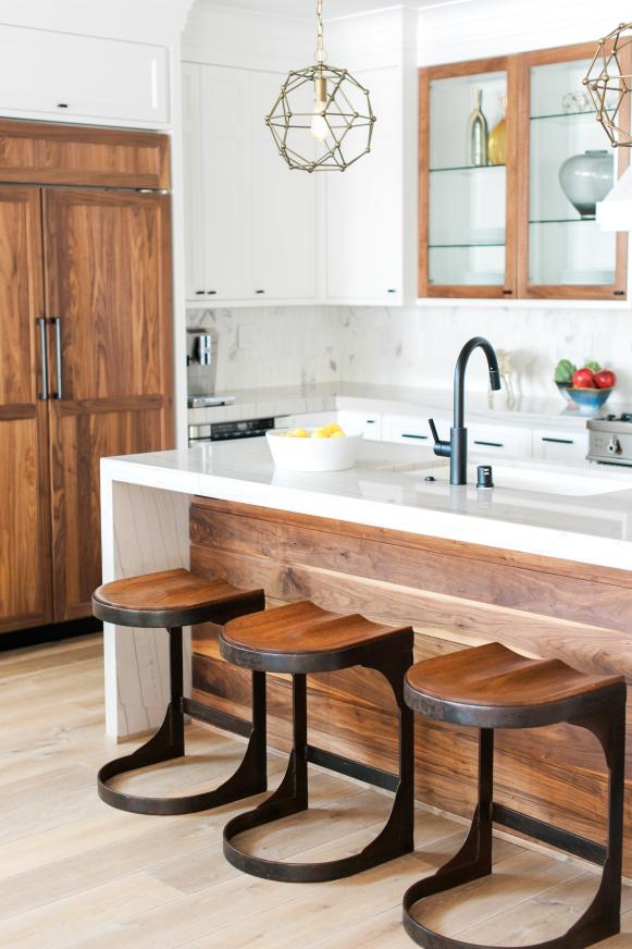 White Kitchen With Wood Paneled Refrigerator