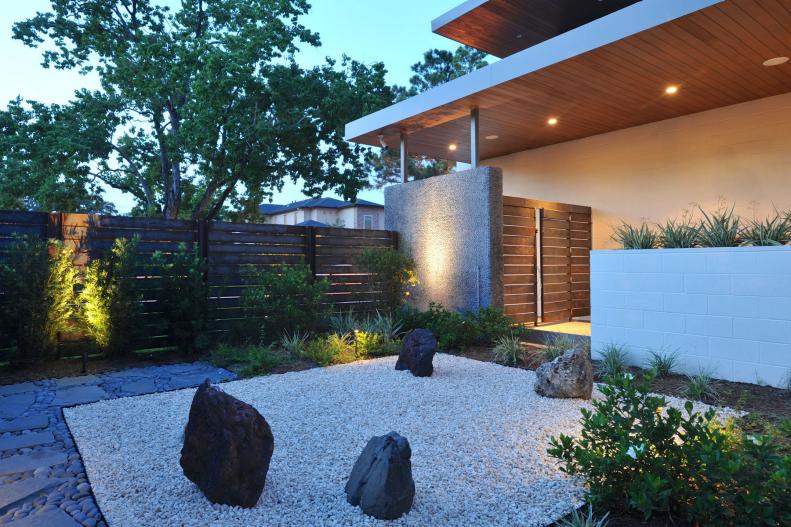 Japanese Rock Garden Surrounded by Wood Privacy Fence and Landscape Plants