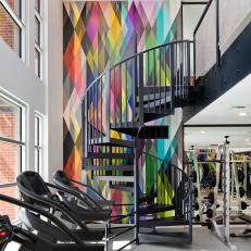 Floor to Ceiling Geometric Wall Covering Makes Gym Bright and Energizing