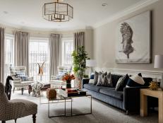 Eclectic Living Room With Gray Sofa, Striped Wingback Chairs
